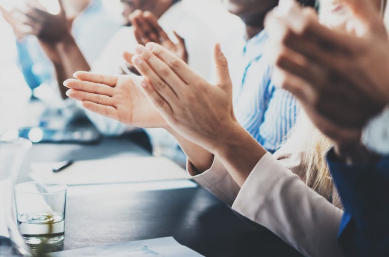 Business professionals clapping